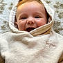 Mattéo a rejoint le concours — aidez-le/la à gagner de superbes lots ! baby, child, hoodie, smile, happy, face, infant, cozy, clothing, embroidery, textile, portrait, closeup, lying_down, carpet, soft_texture, cute, young, indoors, warm