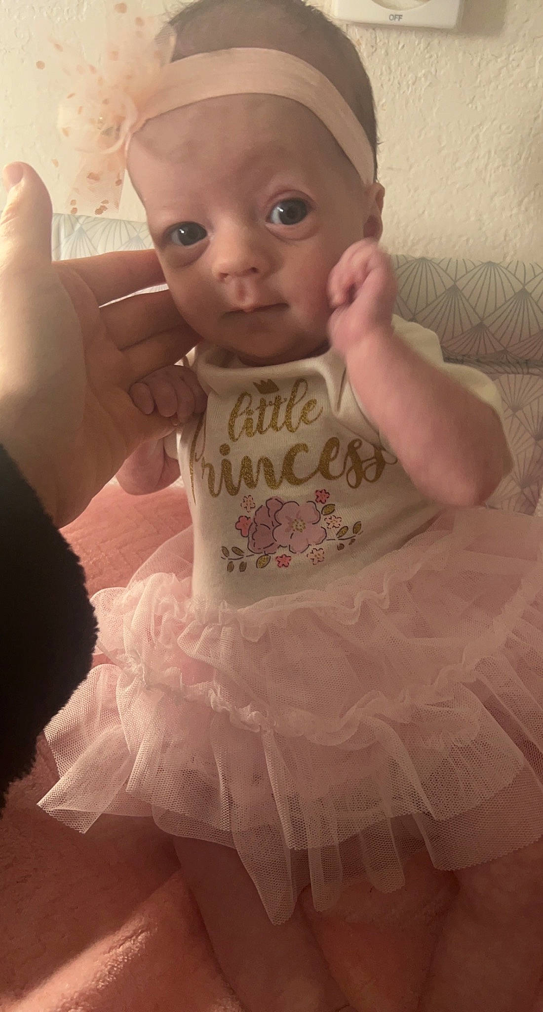 Elaina is registered to the contest to win money with this photo: baby, baby_toddler_clothing, cheek, chin, dress, ear, eye, eyebrow, face, gesture, hairstyle, hand, happy, head, iris, lip, neck, nose, skin, sleeve