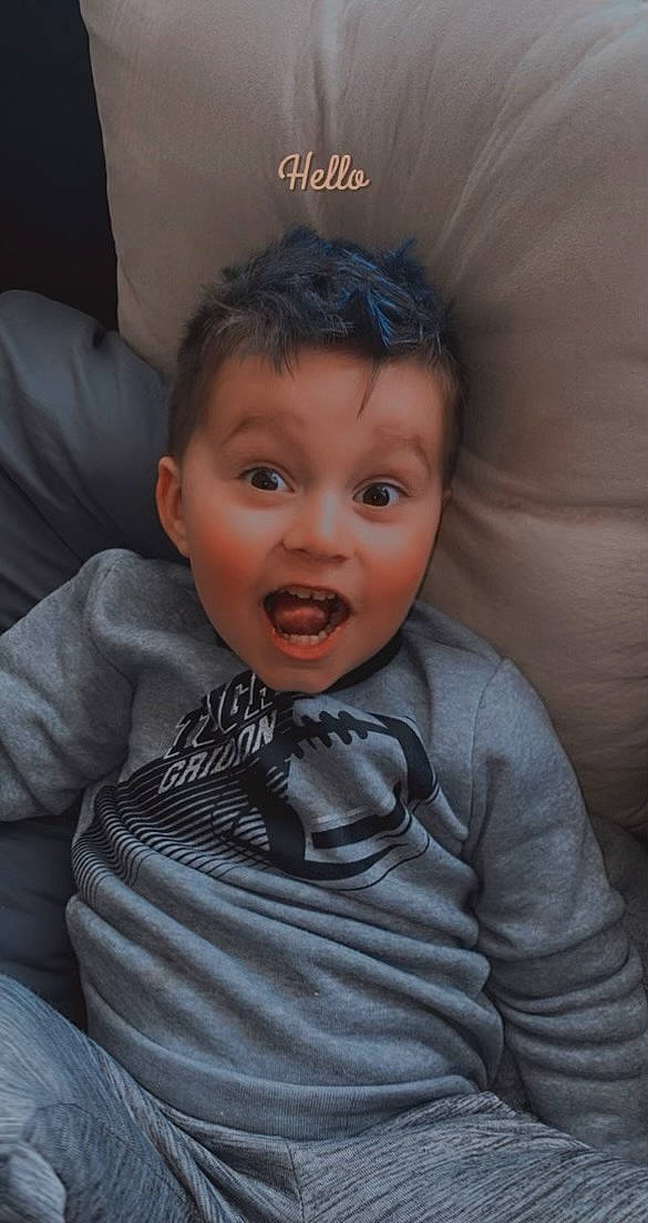 Gabriel is registered to the contest to win money with this photo: cheek, child, collar, comfort, dress_shirt, eyelash, face, fashion_accessory, flash_photography, formal_wear, happy, hat, head, mouth, neck, nose, person, sitting, sleeve, smile