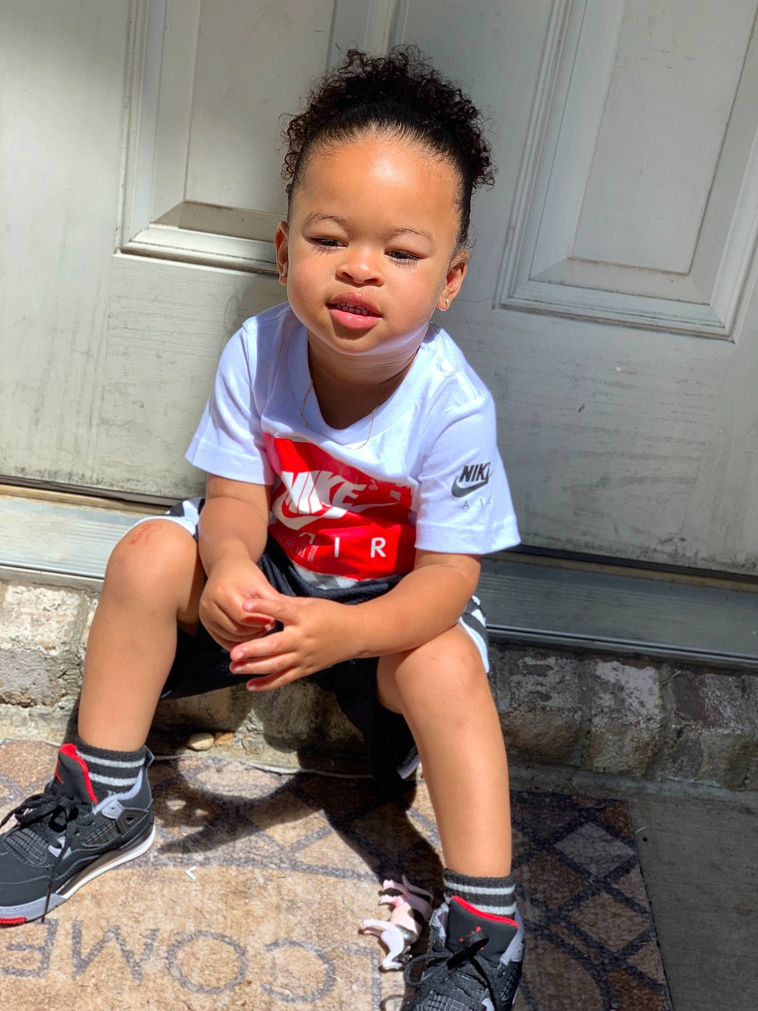 King joined the competition — help win amazing prizes! carmine, child, child_model, cool, footwear, fun, human_leg, knee, leg, person, play, red, shoe, shorts, sitting, skin, smile, sports_gear, t_shirt, thigh