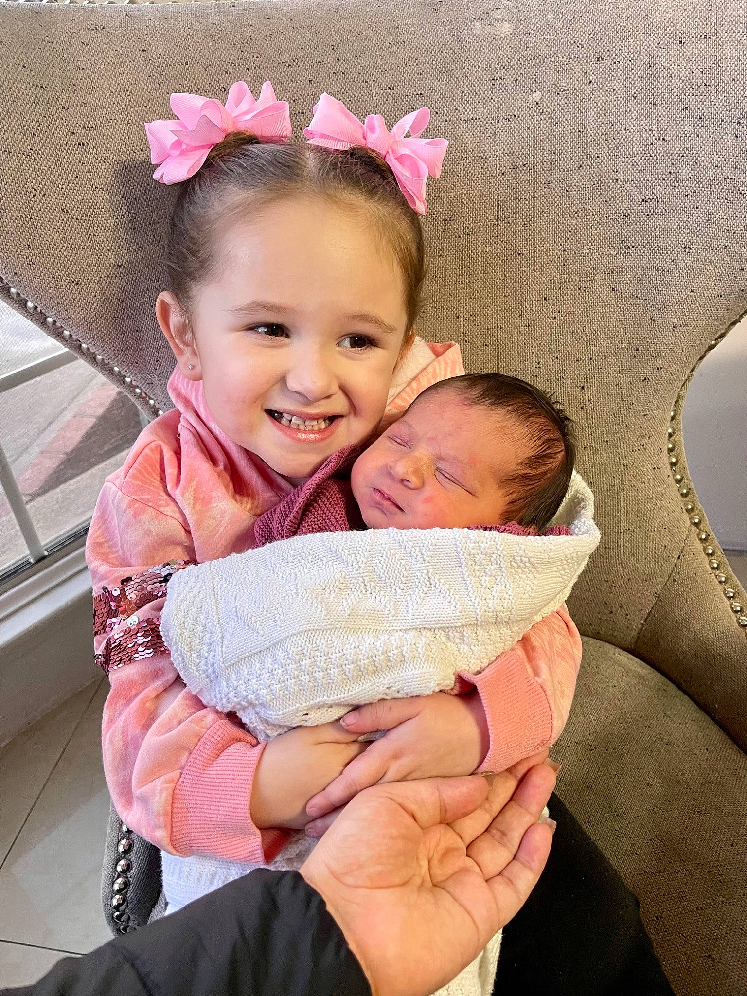 Camila joined the competition — help win amazing prizes! baby, baby_products, baby_toddler_clothing, cheek, child, comfort, face, fashion_accessory, finger, gesture, hair, hand, happy, head, joy, person, pink, sitting, skin, smile