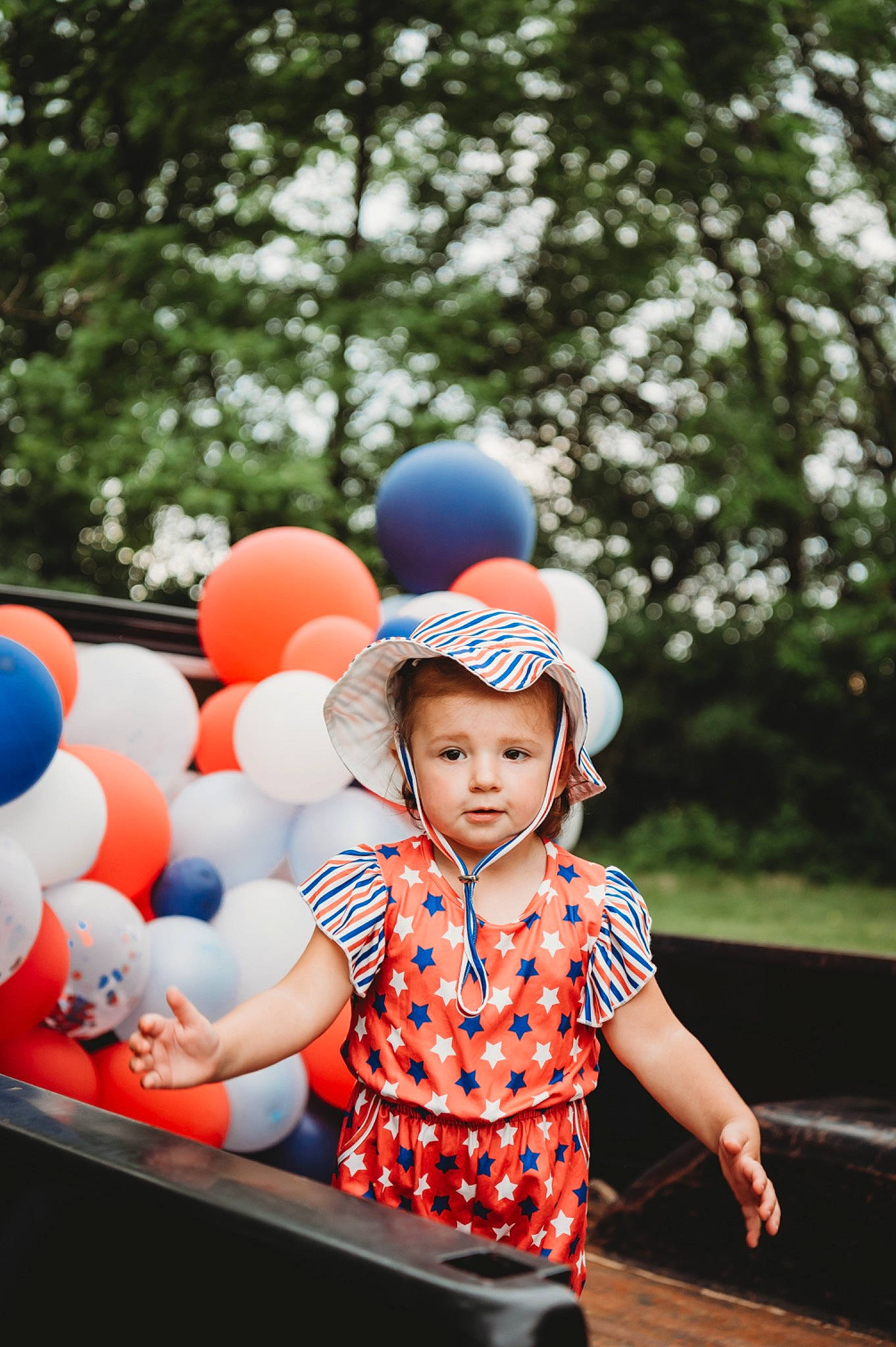 Emberlynn is registered to the contest to win money with this photo: baby, baby_toddler_clothing, balloon, cap, child, electric_blue, event, fashion_accessory, flash_photography, fun, happy, leisure, party_supply, pattern, person, play, recreation, sitting, t_shirt, toddler