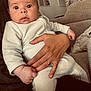 Clotaire a rejoint le concours — aidez-le/la à gagner de superbes lots ! artwork, baby, child, clothing, couch, cozy, decor, expression, eyes, face, furniture, hand, home, infant, interior, person, plant, ring, sitting, warm