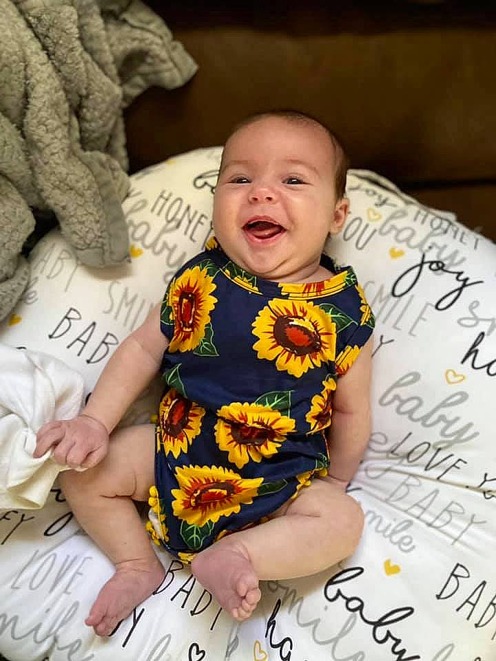 Bexley joined the competition — help win amazing prizes! baby, baby_toddler_clothing, child, comfort, face, finger, fun, fur, happy, linens, mammal, pattern, person, room, sitting, skin, sleeve, smile, t_shirt, textile