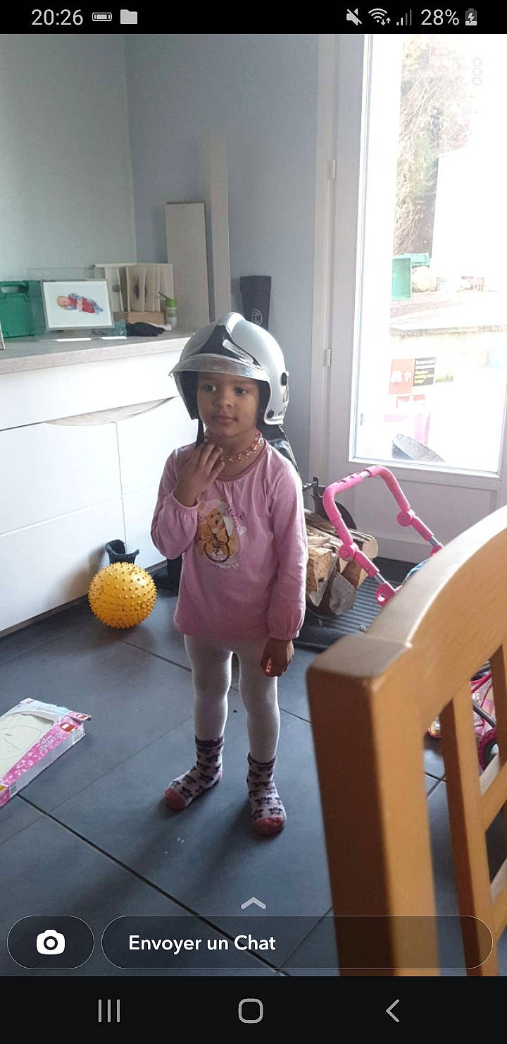 Tyana participe au concours pour gagner de l'argent avec cette photo : ball, child, design, floor, flooring, fun, hardwood, hat, headwear, kitchen, leg, mammal, person, play, room, smile, sneakers, standing, toddler, vertebrate