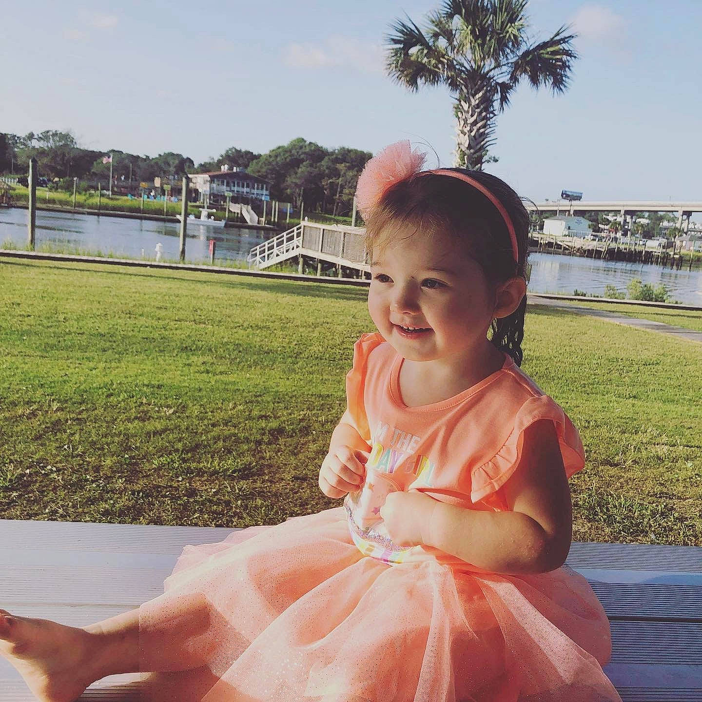 Amara is registered to the contest to win money with this photo: baby_toddler_clothing, beauty, cool, embellishment, event, fun, grass, happy, leisure, person, photograph, pink, plant, skin, sky, smile, summer, toddler, travel, tree