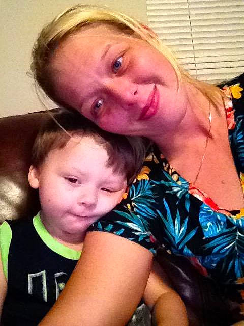 John is registered to the contest to win money with this photo: arm, blond, cheek, child, cool, eye, face, fun, hair, head, interaction, joint, leg, nose, people, person, selfie, skin, smile, toddler