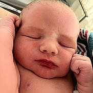 Carter joined the competition — help win amazing prizes! newborn, baby, sleeping, close_up, infant, hand, face, skin, blanket, hospital_bracelet, peaceful, portrait, cute, child, resting, soft_light, indoors, person, newborn_baby, baby_skin