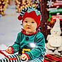 Eden a rejoint le concours — aidez-le/la à gagner de superbes lots ! toddler, child, elf_costume, holiday, christmas, candy_cane, plaid_blanket, festive, cute, smiling, striped_pants, red_hat, decorations, snowman, indoors, portrait, holiday_lights, seasonal, baby, happy