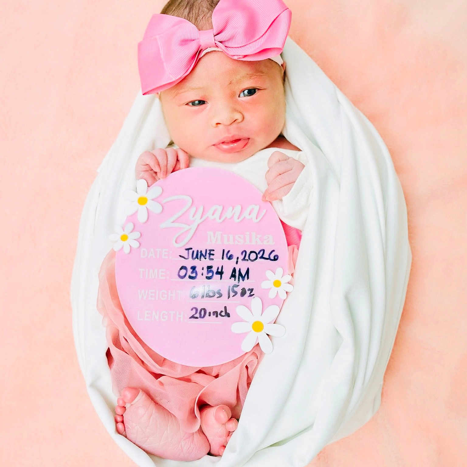Zyana Musika joined the competition — help win amazing prizes! baby, newborn, infant, pink_bow, blanket, swaddled, portrait, cute, soft_background, sign, birth_details, feet, hands, headband, child, lying_down, person, studio_photo, pink, white