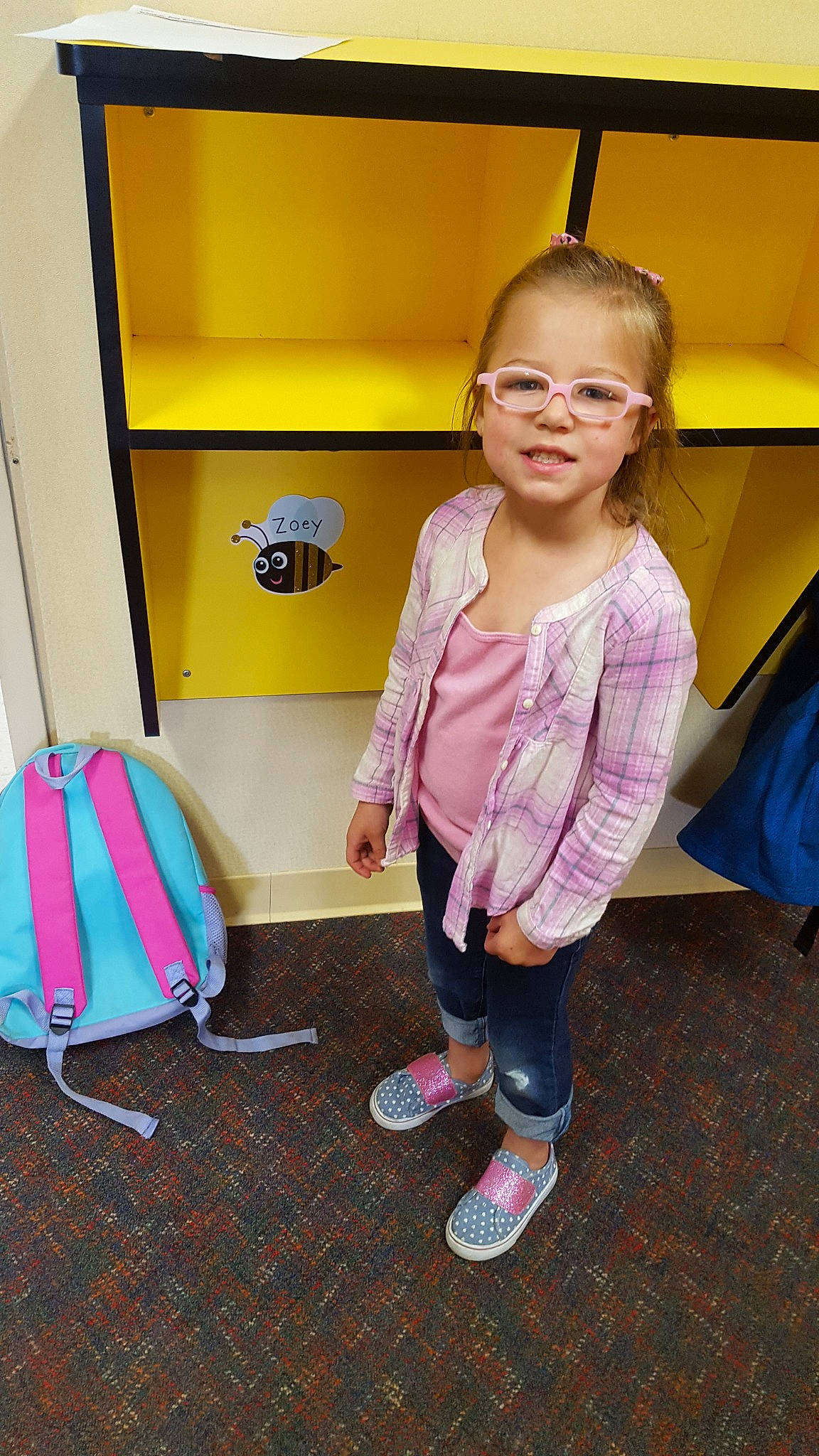 Zoey is registered to the contest to win money with this photo: child, fun, outerwear, person, pink, play, room, smile, standing, toddler, vacation, yellow