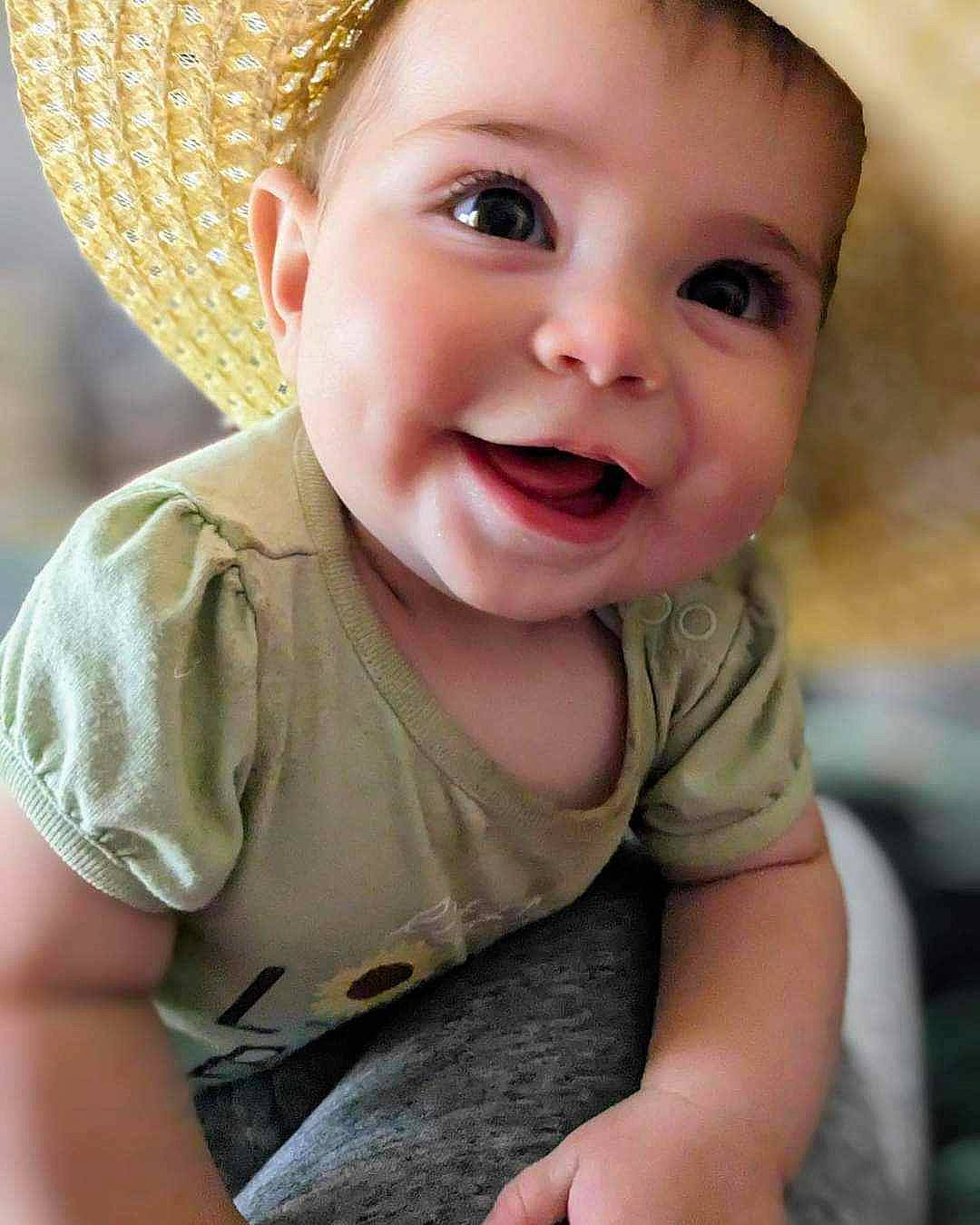 Maisie joined the competition — help win amazing prizes! baby_toddler_clothing, cap, cheek, chin, eye, face, facial_expression, happy, hat, human_body, iris, lip, mouth, nose, organ, person, skin, sleeve, smile, sun_hat