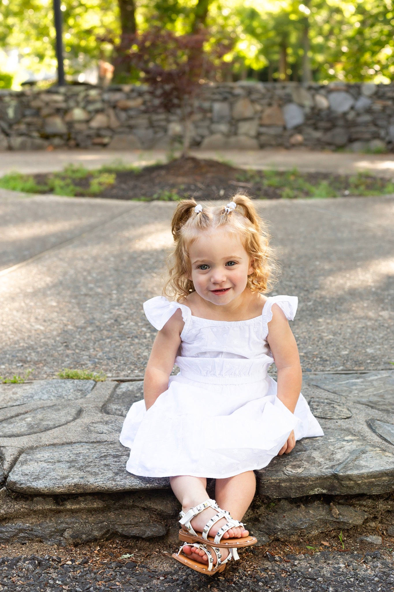 Carmelina is registered to the contest to win money with this photo: asphalt, child, dress, flash_photography, fun, grass, happy, leaf, leisure, people_in_nature, person, plant, road_surface, sandal, sitting, smile, spring, summer, toddler, tree