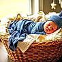 Malone joined the competition — help win amazing prizes! newborn, baby, sleeping, basket, blanket, knit_hat, cozy, indoor, soft_light, wooden_floor, decorations, star, moon, wicker, resting, cute, warm, child, infant, portrait