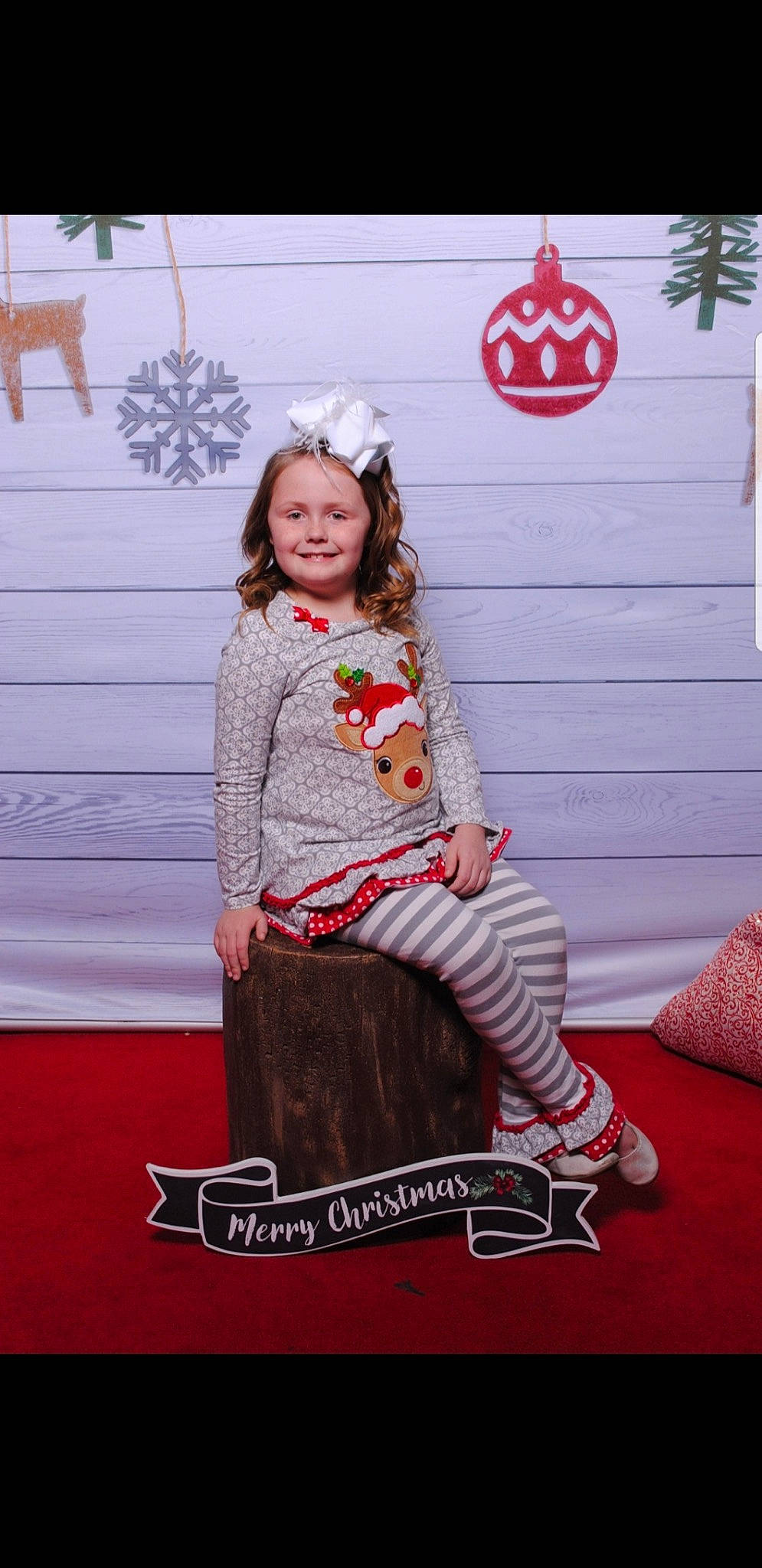 Emry joined the competition — help win amazing prizes! costume, facial_expression, fashion, flooring, fun, girl, headgear, joy, person, photograph, pink, product, red, sitting, smile