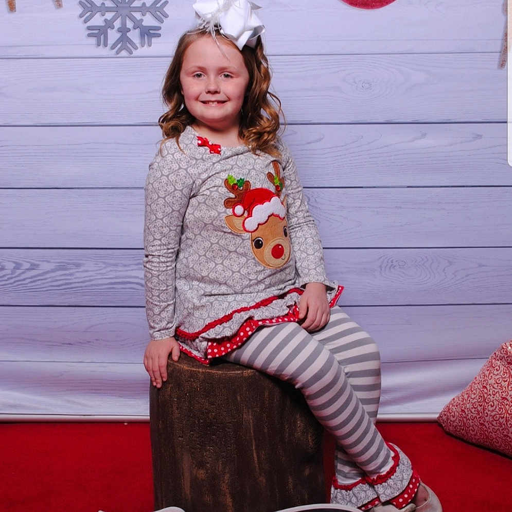 Emry joined the competition — help win amazing prizes! costume, facial_expression, fashion, flooring, fun, girl, headgear, joy, person, photograph, pink, product, red, sitting, smile