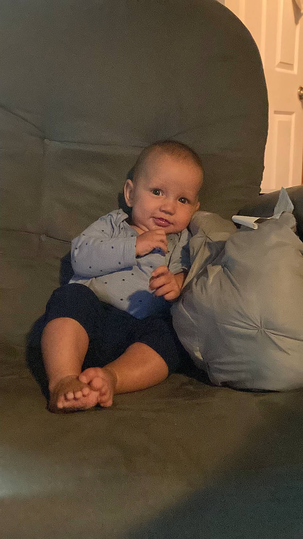Asher is registered to the contest to win money with this photo: abdomen, baby, baby_toddler_clothing, barefoot, cheek, comfort, elbow, eye, finger, flooring, foot, fun, knee, lap, leg, person, skin, sleeve, thigh, toddler