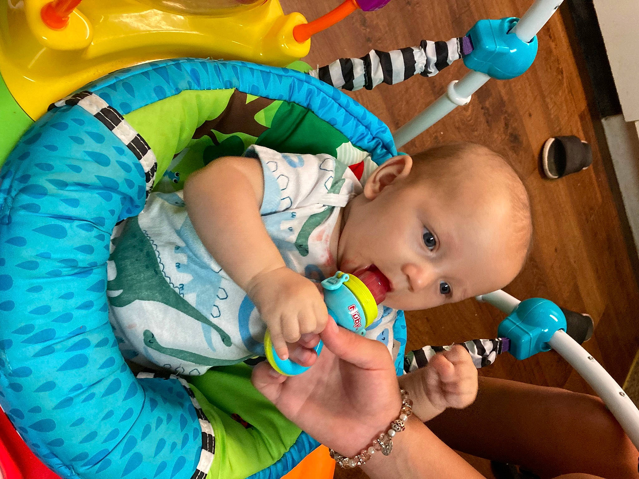 Asher is registered to the contest to win money with this photo: baby, baby_products, baby_toddler_clothing, blue, cheek, child, eye, face, finger, fun, green, hand, happy, head, leisure, mouth, nail, person, skin, surprise