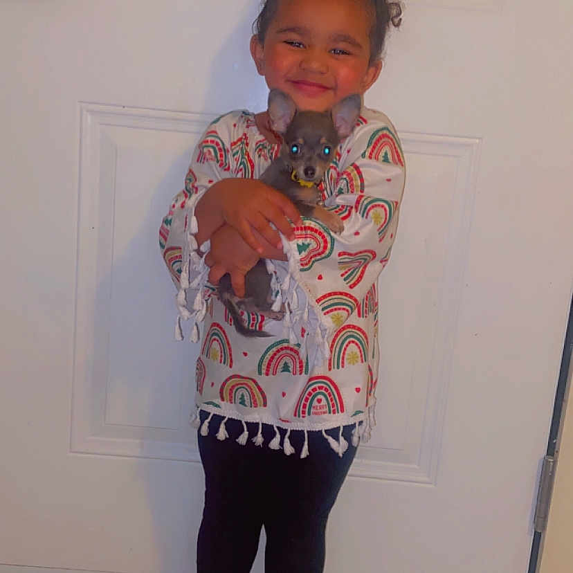 Serenity is registered to the contest to win money with this photo: bodypart, clothing, door, dress, face, finger, hand, happy, head, knitwear, longsleeve, pants, person, photography, portrait, shorts, sleeve, smile, sweater, wood