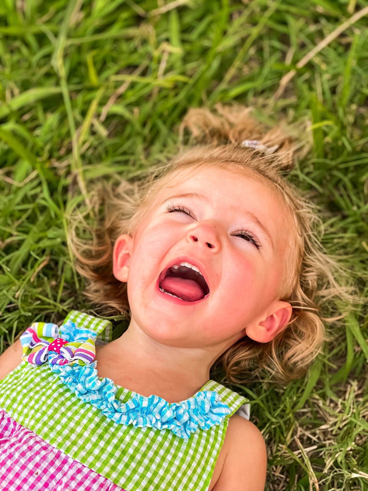 Adalydah is registered to the contest to win money with this photo: baby, baby_toddler_clothing, cheek, child, eye, fun, grass, grass_family, grassland, green, happy, iris, leisure, lip, nose, pattern, people_in_nature, person, skin, summer