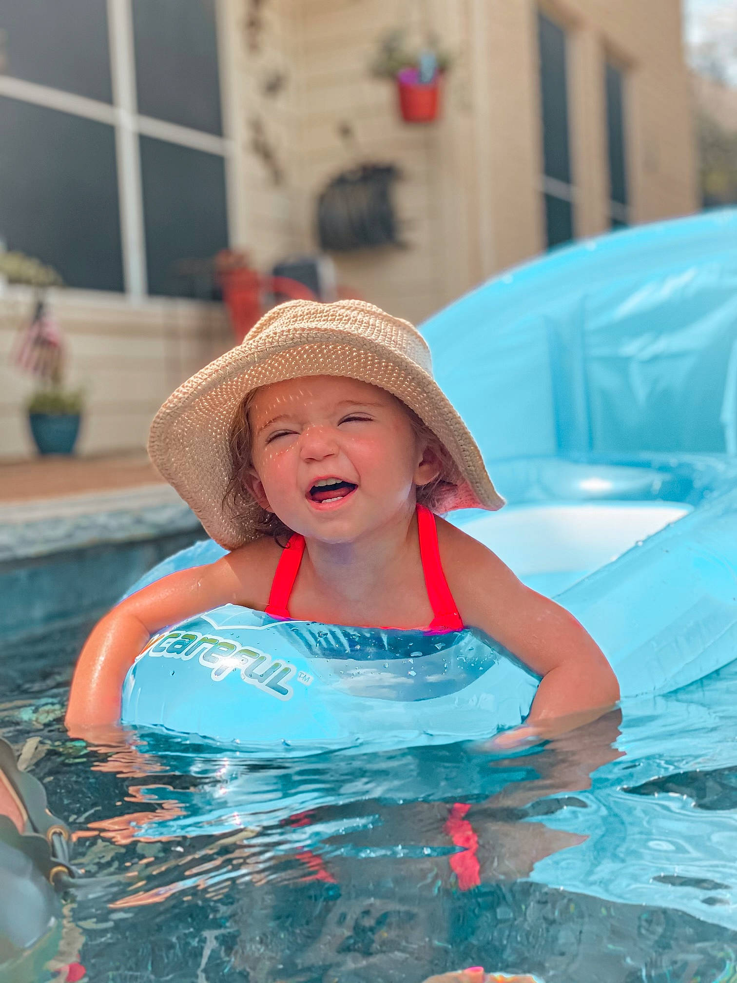 Adalydah is registered to the contest to win money with this photo: aqua, azure, bathing, cap, child, facial_expression, fun, happy, hat, headgear, headwear, leisure, person, personal_protective_equipment, photograph, pink, recreation, summer, sun_hat, swimming_pool