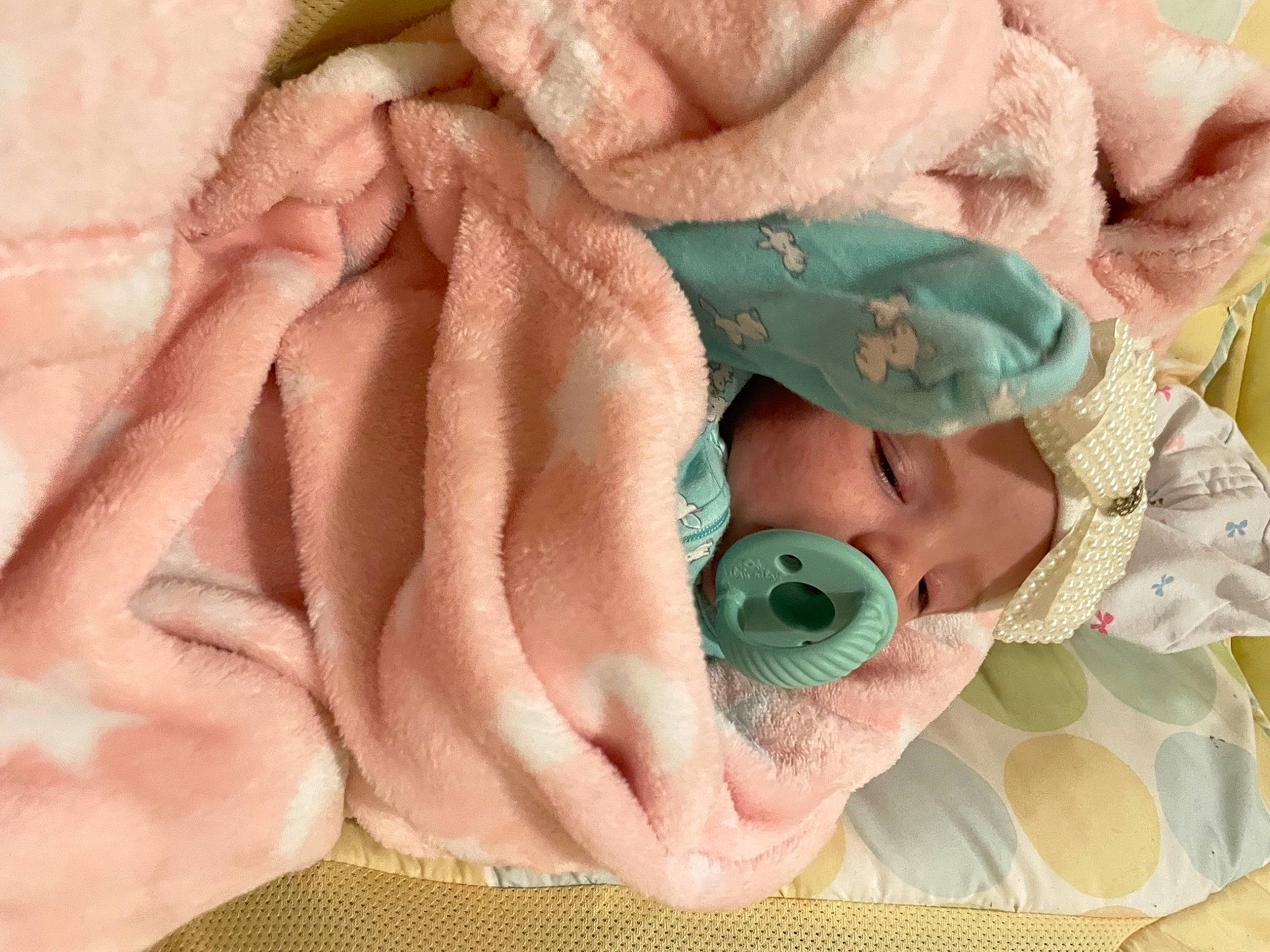 Azalynn is registered to the contest to win money with this photo: baby, baby_products, baby_sleeping, baby_toddler_clothing, bedtime, blanket, child, comfort, fur, headgear, headwear, linens, pattern, peach, person, pink, skin, sleep, textile, toddler