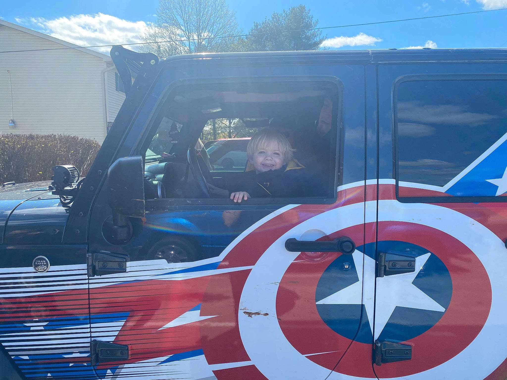 Reese is registered to the contest to win money with this photo: aerospace_manufacturer, air_travel, aircraft, automotive_design, automotive_exterior, automotive_lighting, automotive_tire, automotive_wheel_system, aviation, blue, cloud, electric_blue, hood, joy, mode_of_transport, motor_vehicle, person, propeller, sky, vehicle