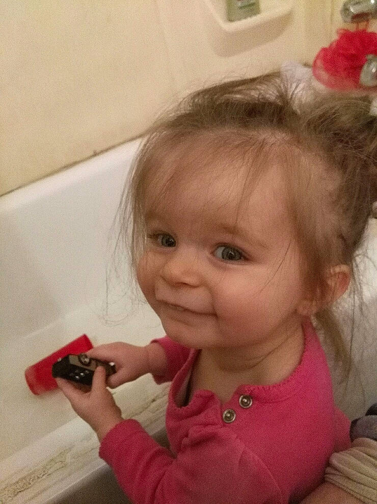 Belladonna is registered to the contest to win money with this photo: baby, blond, cheek, child, daughter, ear, electronic_device, eye, face, hair, head, lip, mobile_phone, nose, person, play, skin, smile, toddler