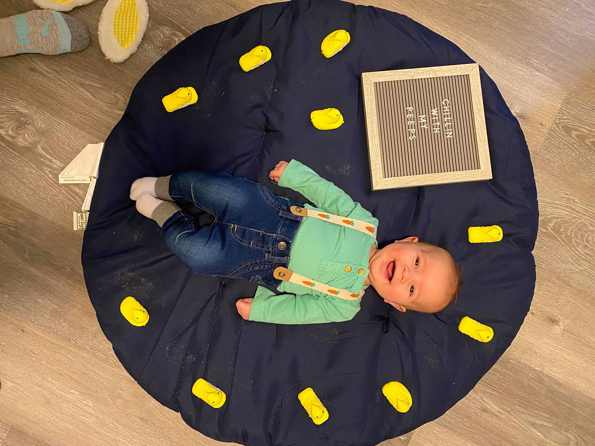 Vayder is registered to the contest to win money with this photo: auto_part, baby, baby_products, baby_toddler_clothing, baby_toys, bag, child, comfort, fashion_accessory, flooring, font, hardwood, pattern, person, personal_protective_equipment, sitting, sleeve, t_shirt, toddler, wood