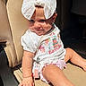 Blakely is registered to the contest to win money with this photo: baby, child, bow, birthday, car_seat, clothing, cute, face, hand, infant, kid, light, one_person, person, pink, pose, seat, sitting, smile, white