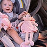 baby, child, car_seat, doll, toy, pink, bow, smile, blue_eyes, footwear, seatbelt, car_interior, cute, infant, clothing, safety, happy, person, portrait, sitting