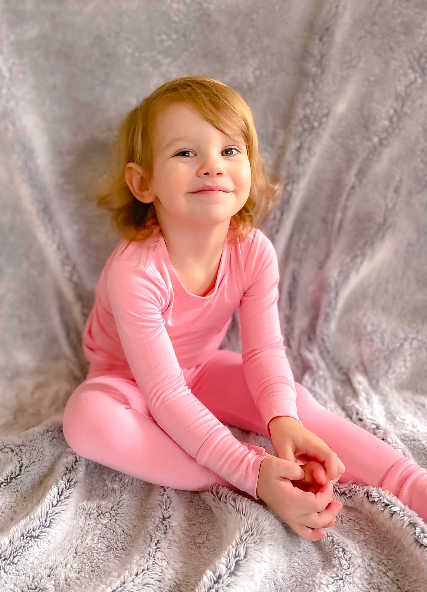 Atley is registered to the contest to win money with this photo: baby_toddler_clothing, blond, brown_hair, child, comfort, flooring, fun, happy, human_leg, joy, knee, lip, magenta, person, pink, sitting, skin, sleeve, smile, textile