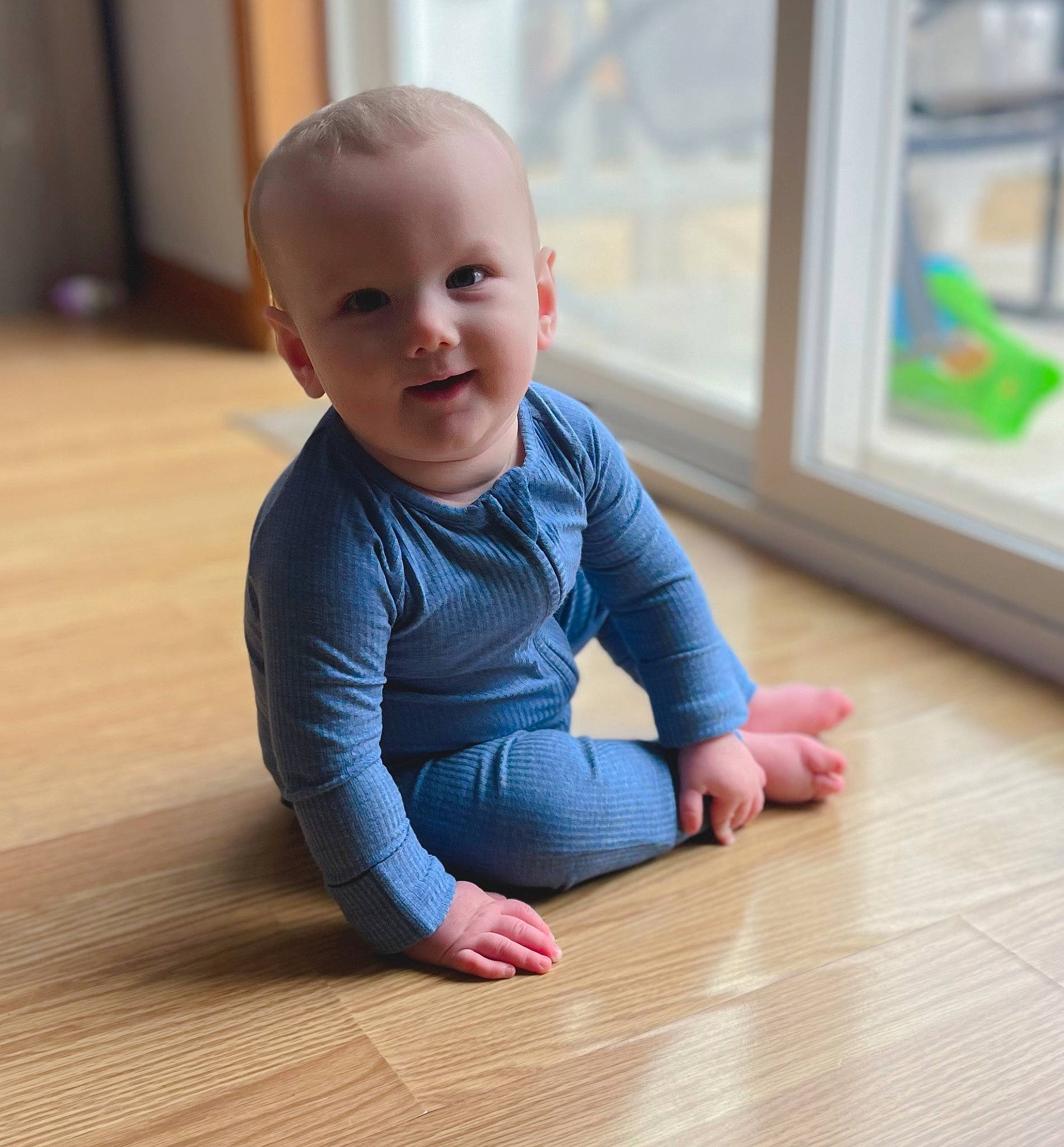 Maddox is registered to the contest to win money with this photo: baby, baby_crawling, baby_toddler_clothing, cheek, chin, dress, floor, flooring, happy, hardwood, human_body, joint, laminate_flooring, person, skin, sleeve, smile, thumb, toddler, wood