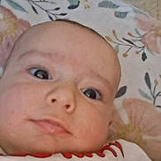 Renesmay joined the competition — help win amazing prizes! baby, blanket, casual, child, closeup, clothing, cute, expression, eyes, face, floral, indoors, infant, laying, person, portrait, red_text, skin, textile, young