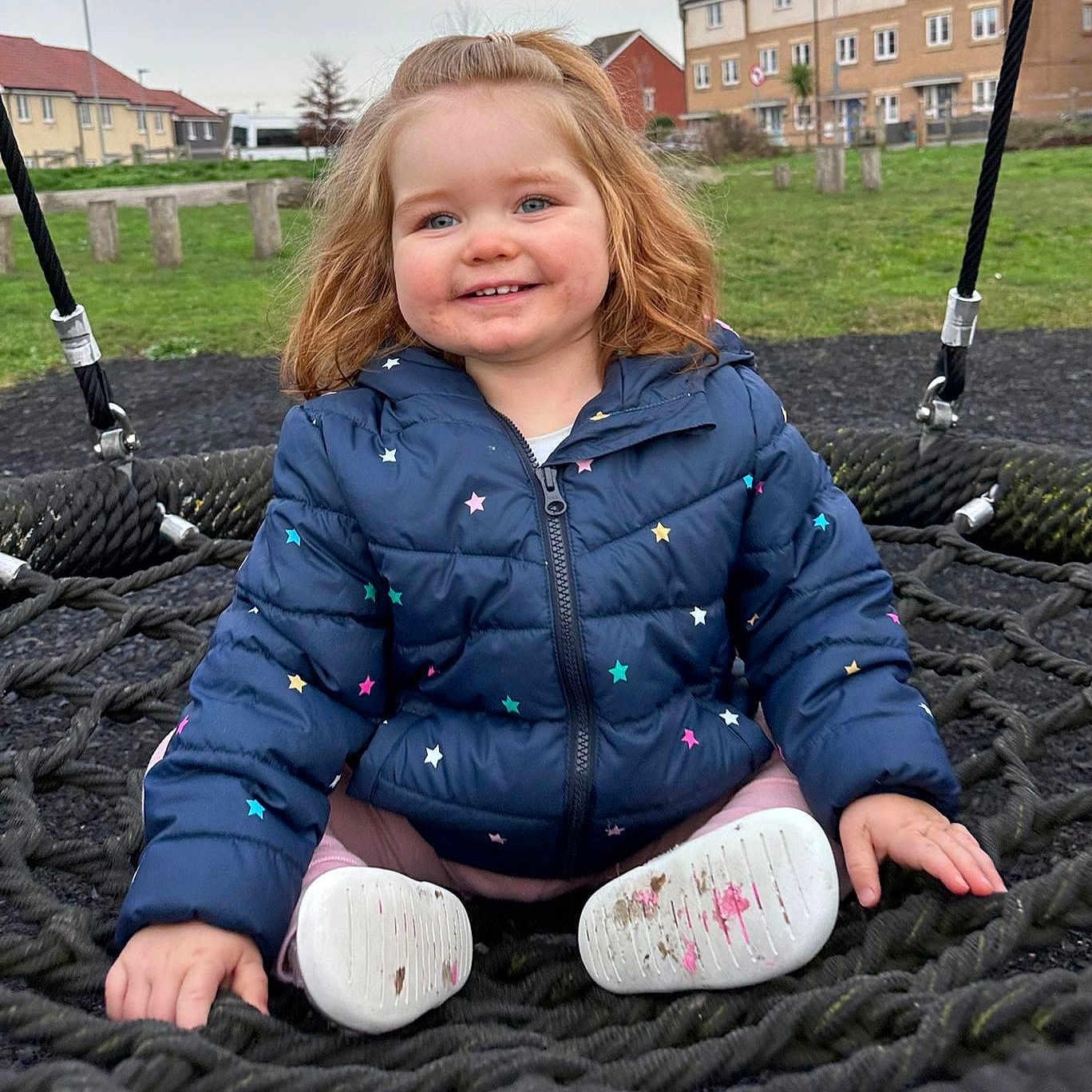 Elsie is registered to the contest to win money with this photo: blanket, blonde, bodypart, brownhair, child, clothing, coat, face, female, furniture, girl, grass, hair, happy, head, jacket, jeans, mouth, nature, outdoorplayarea