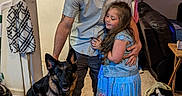 Raven joined the competition — help win amazing prizes! man, girl, dog, german_shepherd, hug, indoor, carpet, casual_clothing, cap, smile, family_photos, lamp, sofa, table, apron, wall_art, home, tattoo, long_hair, footwear