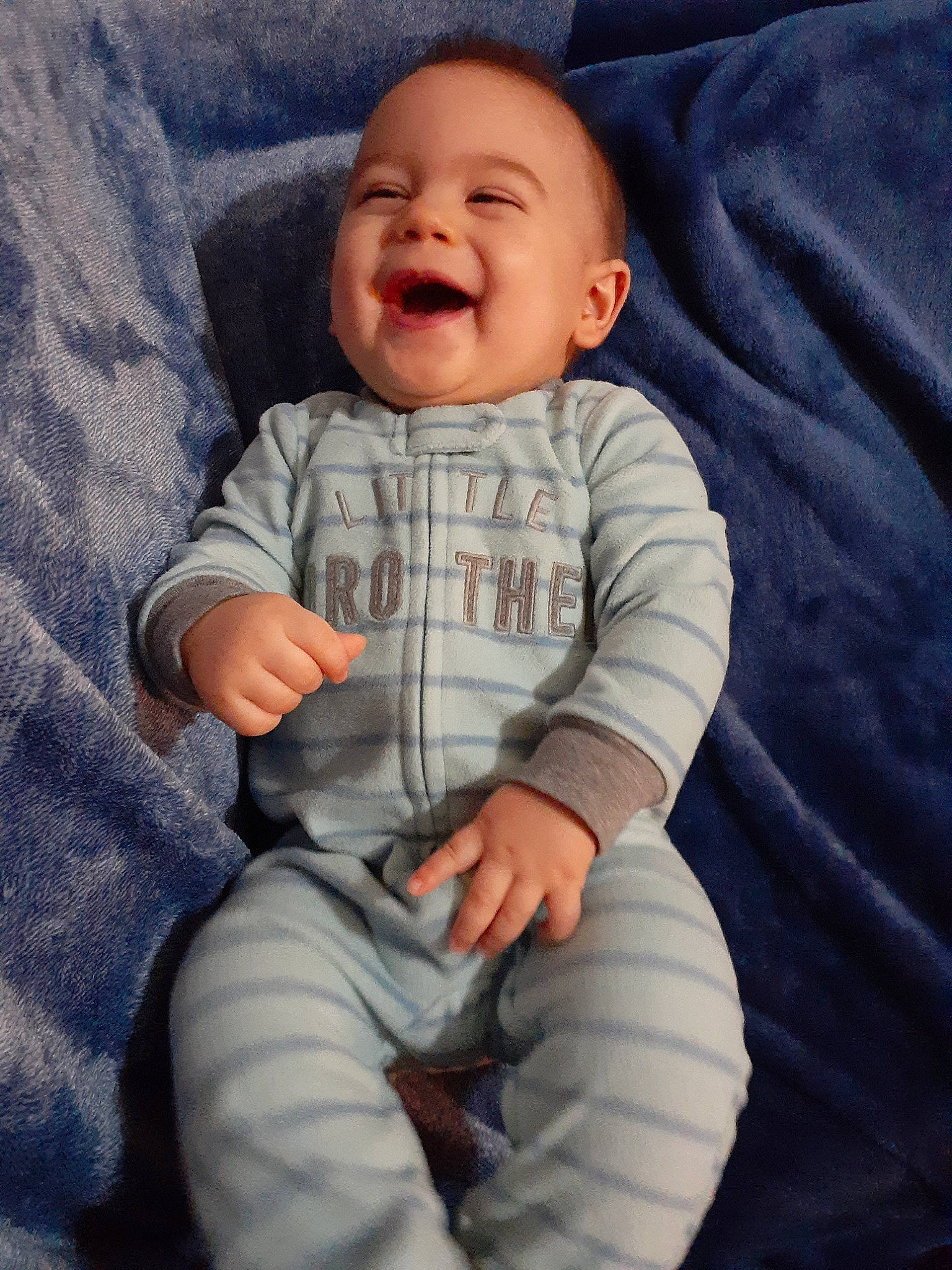 Brock is registered to the contest to win money with this photo: baby, child, comfort, facial_expression, laugh, person, sitting, smile, toddler