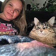 Smores joined the competition — help win amazing prizes! woman, cat, blanket, couch, indoor, portrait, pet, feline, long_hair, smile, relaxing, plant, furniture, casual, home, comfort, cozy, face, leisure, animal