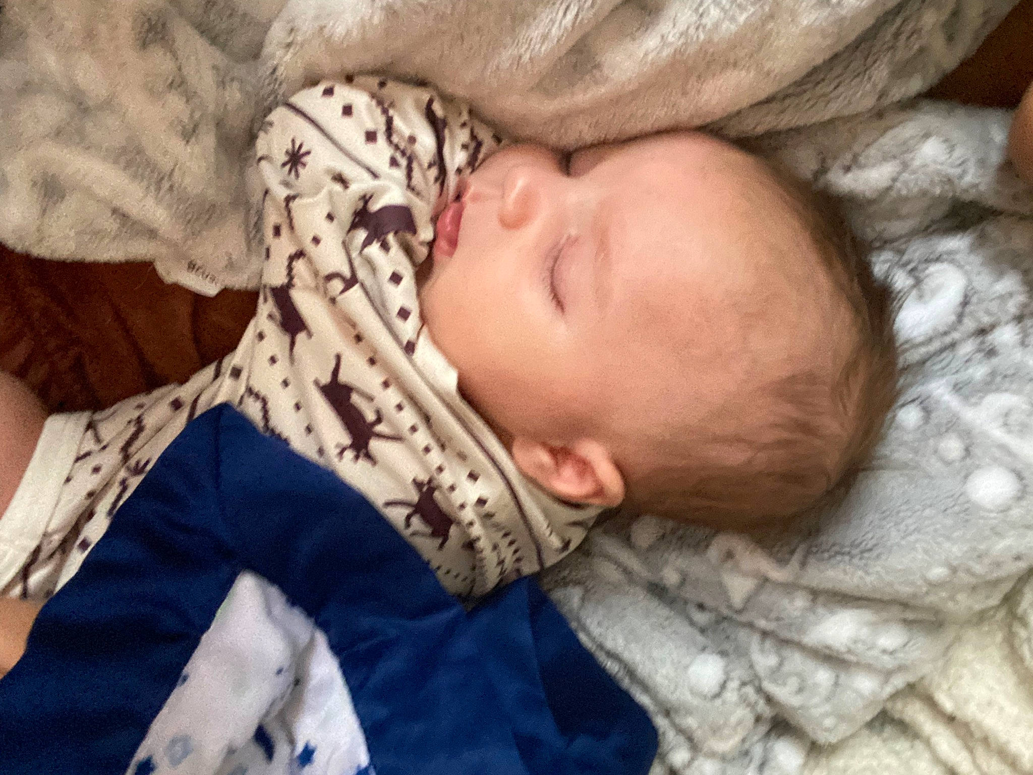 Leon is registered to the contest to win money with this photo: baby, baby_toddler_clothing, bedtime, cheek, child, comfort, linens, nap, pattern, person, skin, sleep, textile, toddler