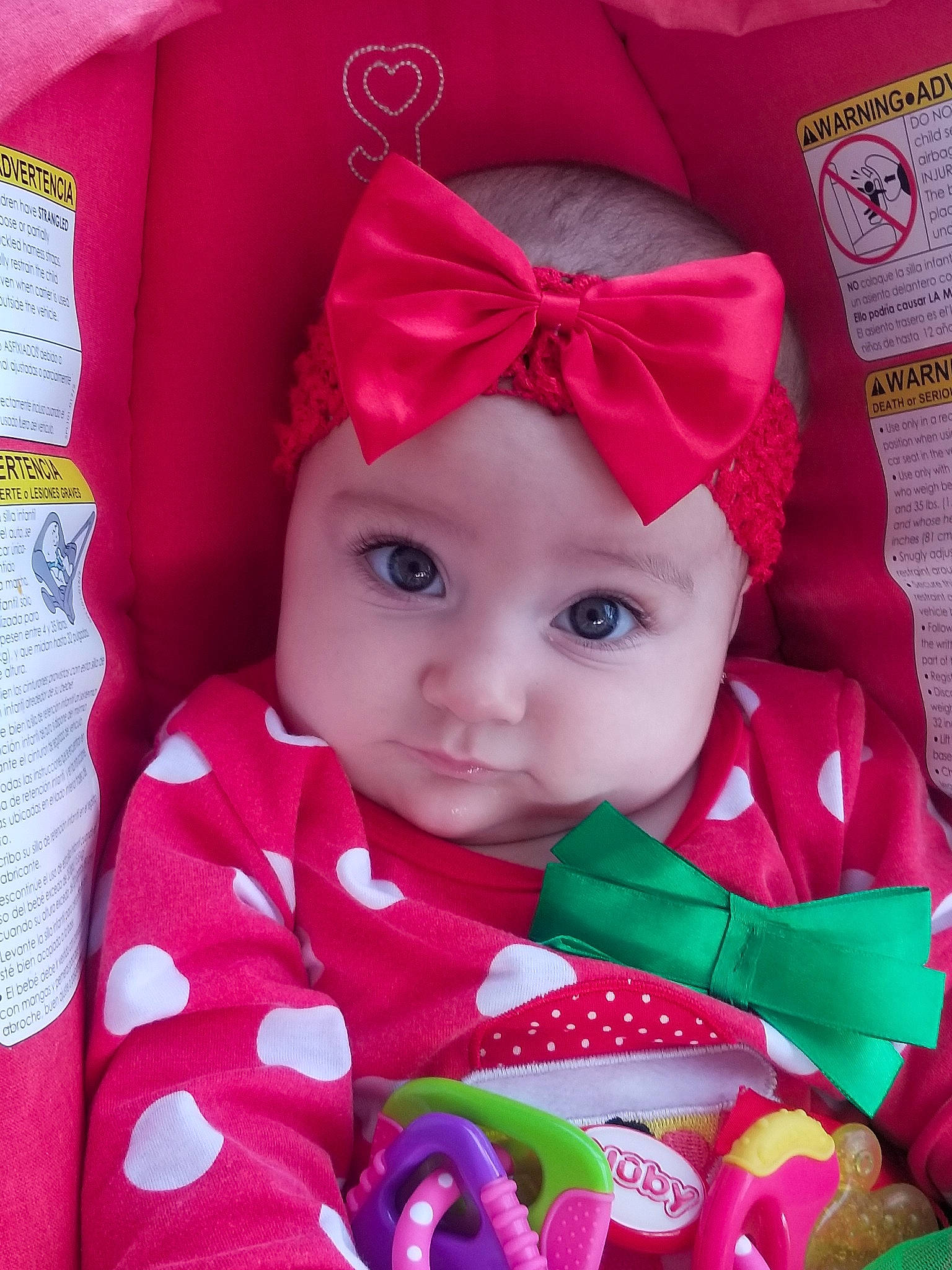 Angie is registered to the contest to win money with this photo: baby_products, beauty, cheek, child, eye, girl, hair_accessory, infant, iris, magenta, person, petal, pink, product, red, skin, smile, textile, toddler