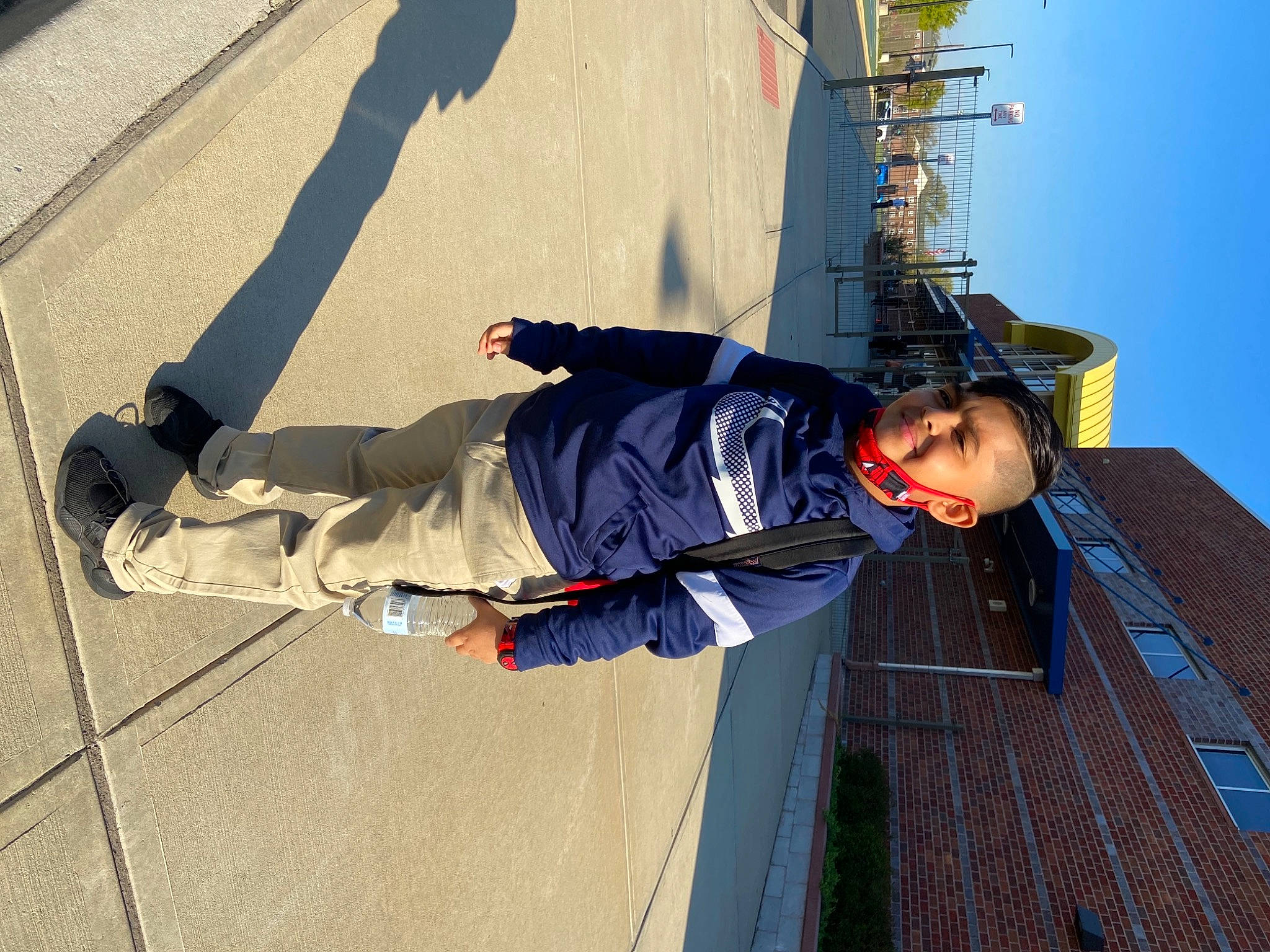 Jacob is registered to the contest to win money with this photo: adventure, asphalt, concrete, electric_blue, fun, joy, leisure, outdoor_shoe, person, recreation, rope, shadow, sky, slope, smile, travel, walking_shoe, wood