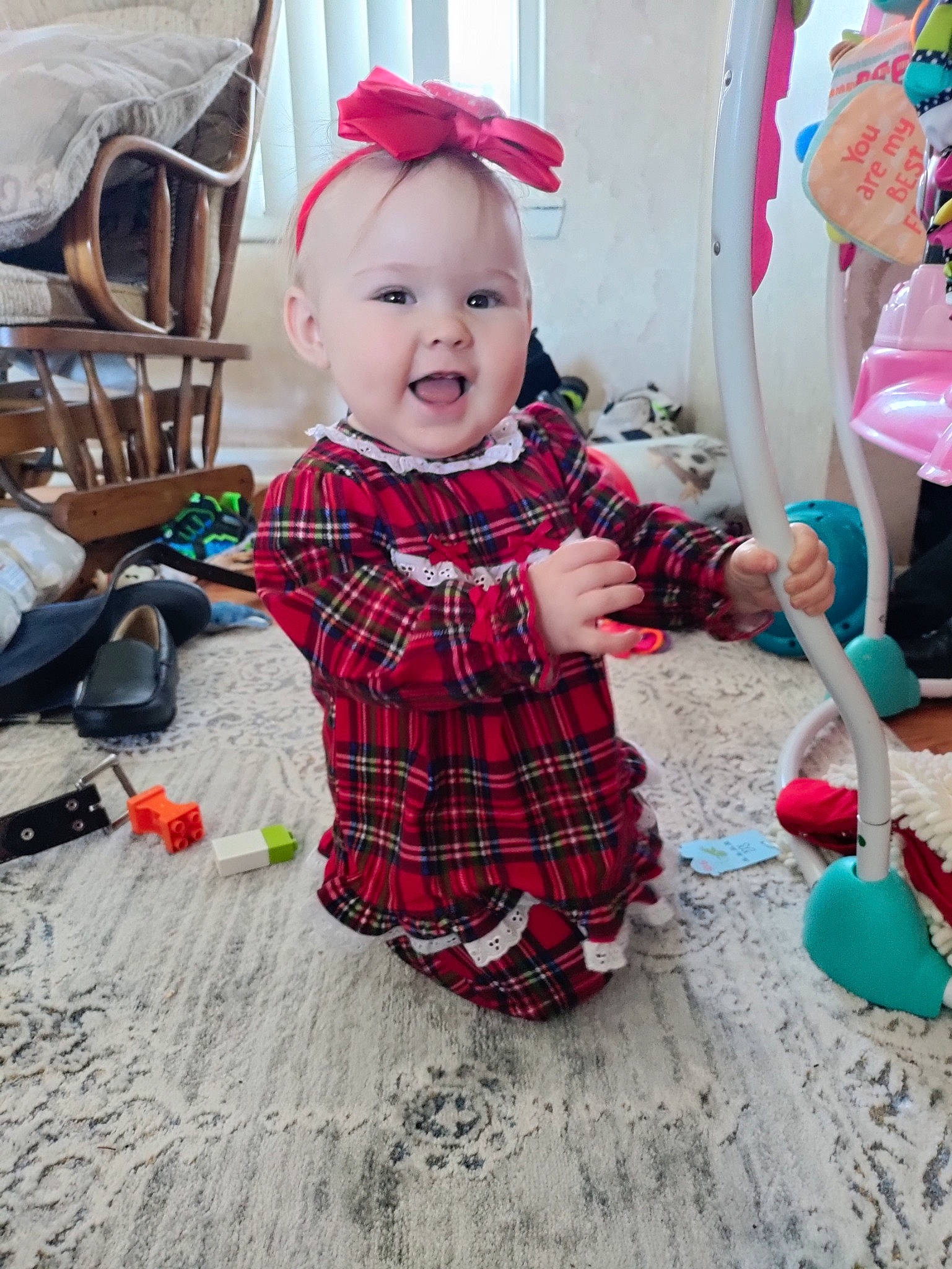 Holly is registered to the contest to win money with this photo: baby, baby_products, baby_toddler_clothing, child, christmas, fun, happy, holiday, pattern, people, person, plaid, red, sitting, sleeve, smile, tartan, textile, toddler, toy