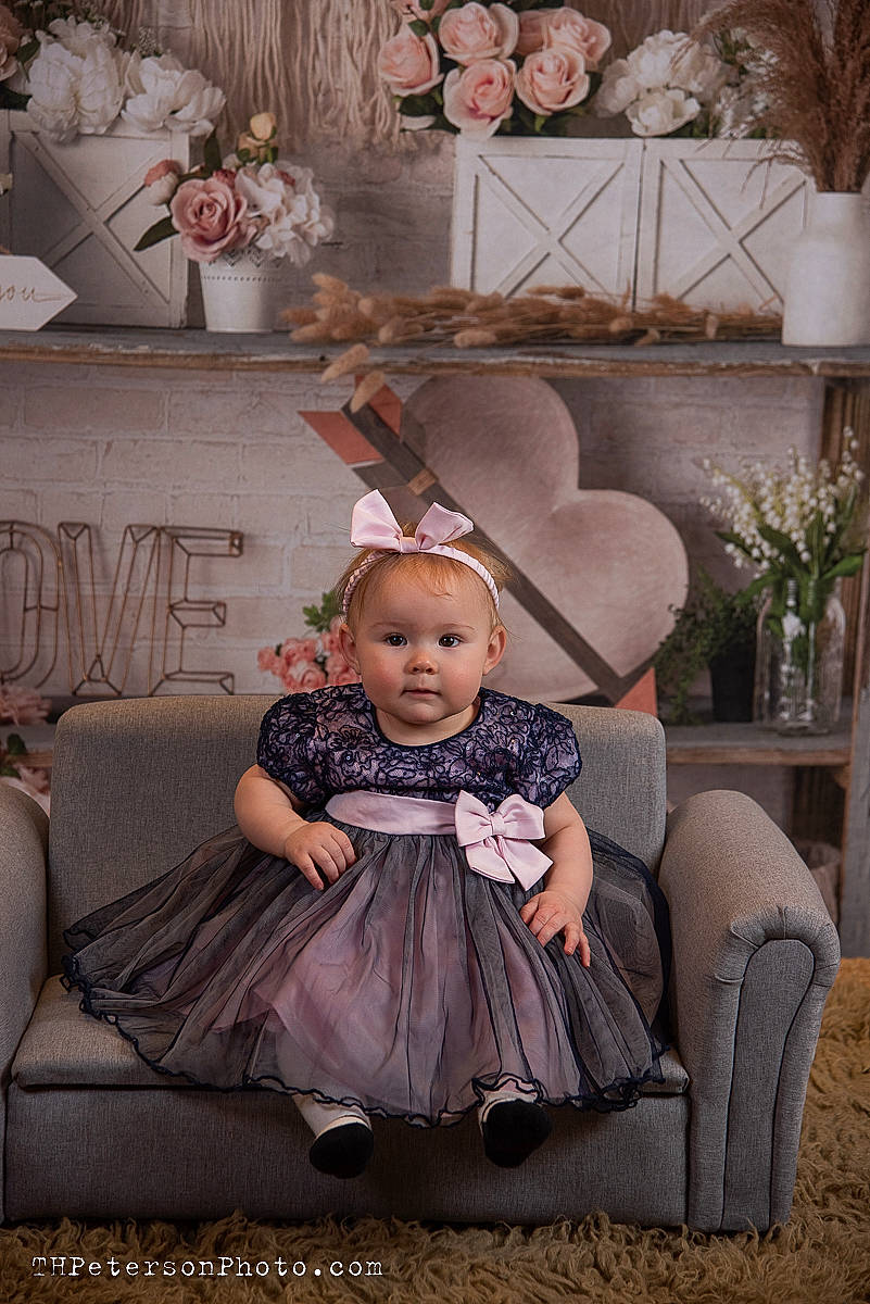 Holly joined the competition — help win amazing prizes! baby, baby_toddler_clothing, child, comfort, dress, event, fashion, flash_photography, flowerpot, happy, houseplant, living_room, person, picture_frame, pink, plant, purple, sitting, style, toddler