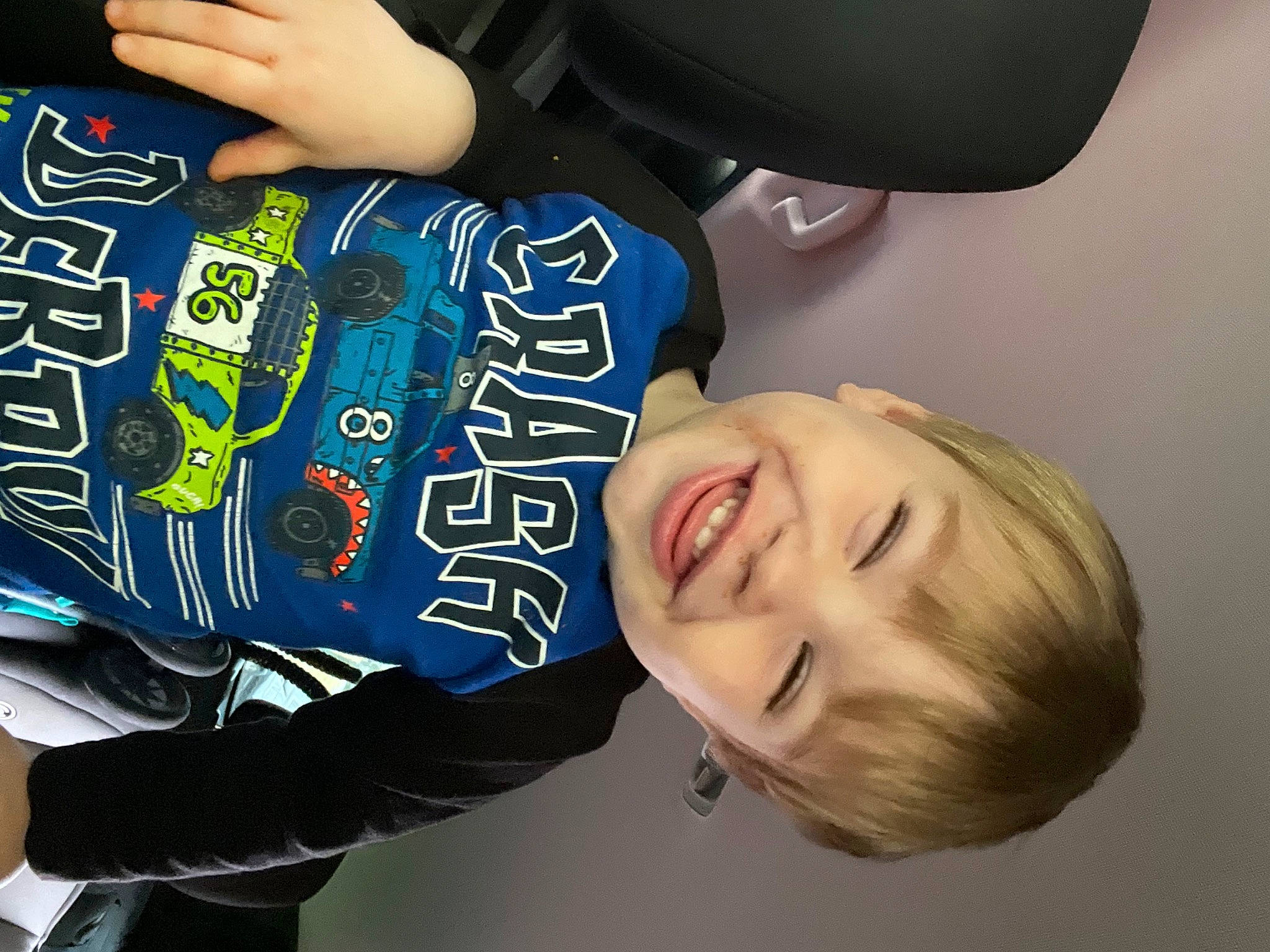Cooper is registered to the contest to win money with this photo: baby, baby_toddler_clothing, cheek, child, elbow, electric_blue, fun, gesture, happy, human_body, joy, laugh, mouth, nail, person, sitting, sleeve, smile, t_shirt, thumb