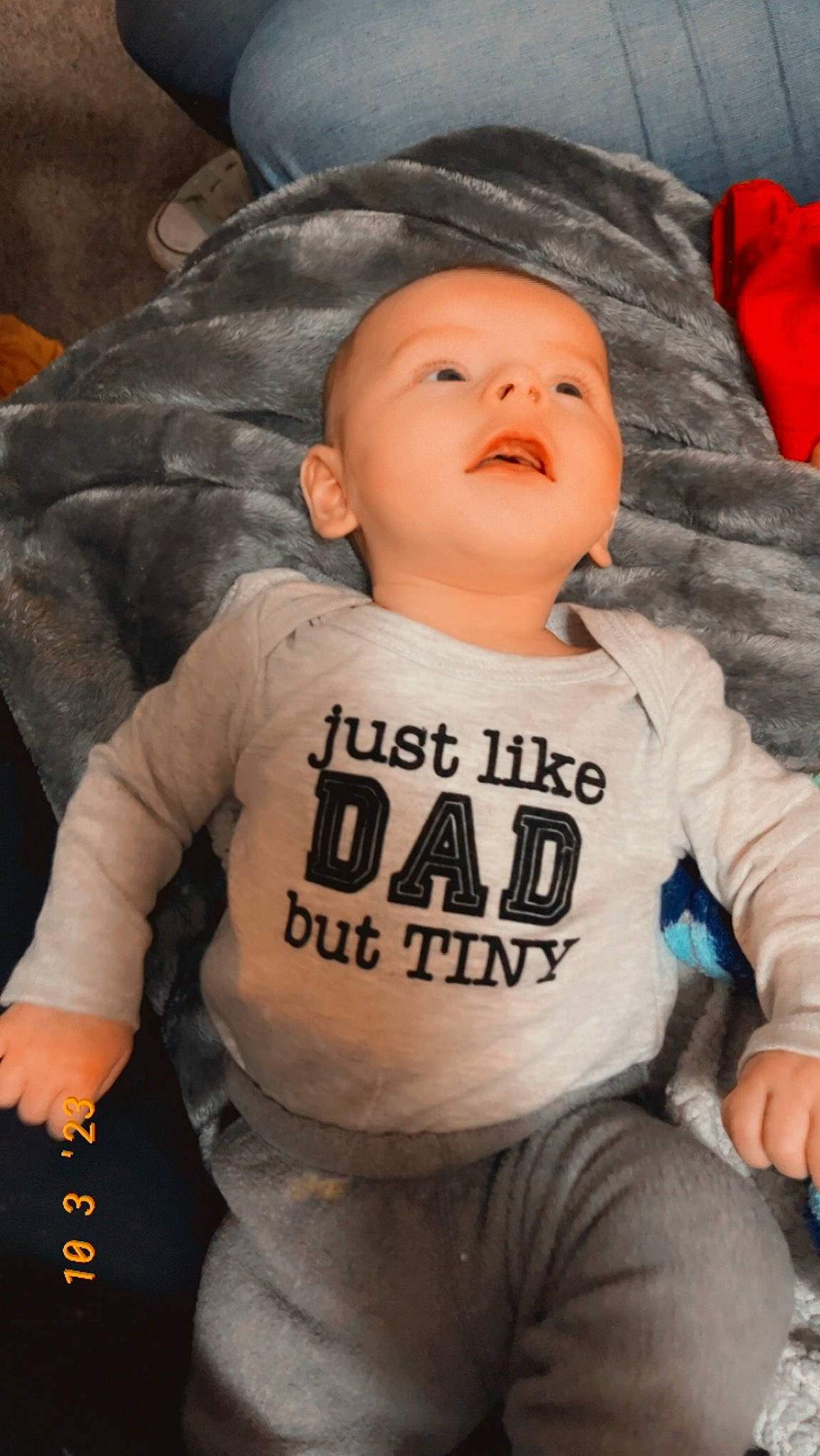 Renly joined the competition — help win amazing prizes! baby, baby_products, baby_toddler_clothing, chair, cheek, chest, child, comfort, cool, flash_photography, fun, happy, orange, person, personal_protective_equipment, sitting, sleeve, smile, sportswear, t_shirt