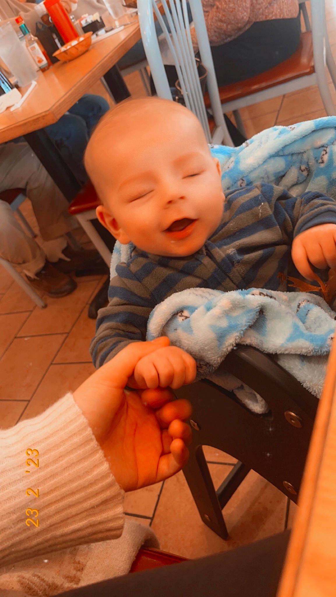 Renly joined the competition — help win amazing prizes! arm, baby, baby_toddler_clothing, chair, cheek, child, comfort, finger, flooring, gesture, hand, joint, lap, leg, mouth, person, skin, smile, thumb, toddler