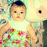 Athena is registered to the contest to win money with this photo: animal_print, baby, blanket, blue_eyes, child, cute, face, floral_pattern, green, hand, indoors, infant, lying_down, pink, plush_toy, portrait, soft_toy, toddler, white_clothing, young_child