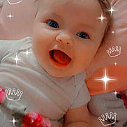 Athena joined the competition — help win amazing prizes! adorable, baby, blanket, blue_eyes, child, closeup, clothing, crown_overlay, cute, face, happy, indoors, infant, lying_down, pink, portrait, smiling, soft_toys, sparkle_overlay, young