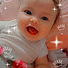 adorable, baby, blanket, blue_eyes, child, closeup, clothing, crown_overlay, cute, face, happy, indoors, infant, lying_down, pink, portrait, smiling, soft_toys, sparkle_overlay, young
