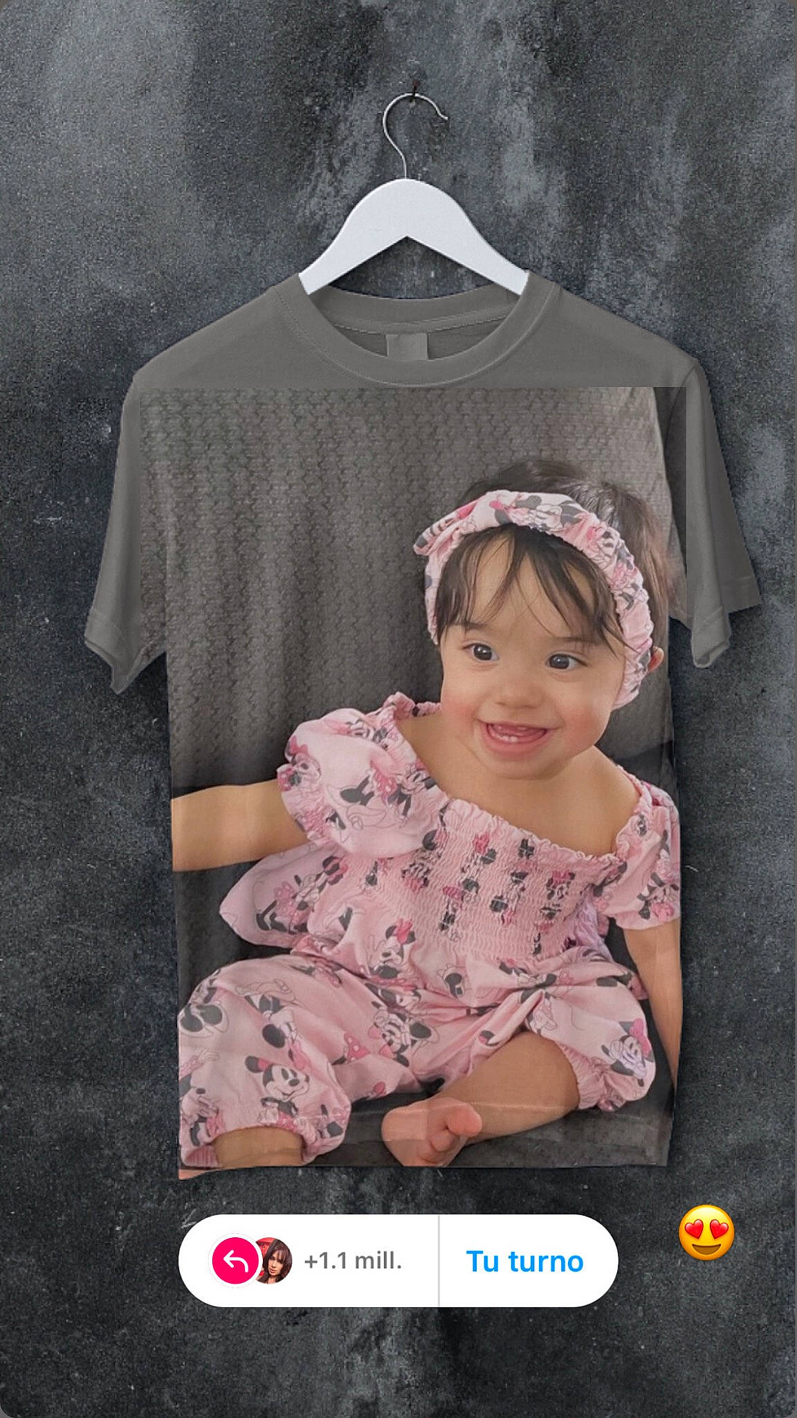 Maya is registered to the contest to win money with this photo: baby_products, baby_toddler_clothing, child, clothes_hanger, dress, eyelash, fashion_design, font, happy, joy, magenta, pattern, peach, person, pink, product, sleeve, smile, t_shirt, toddler